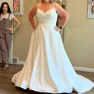 White satin wedding dress. Bought off the rack, never worn.